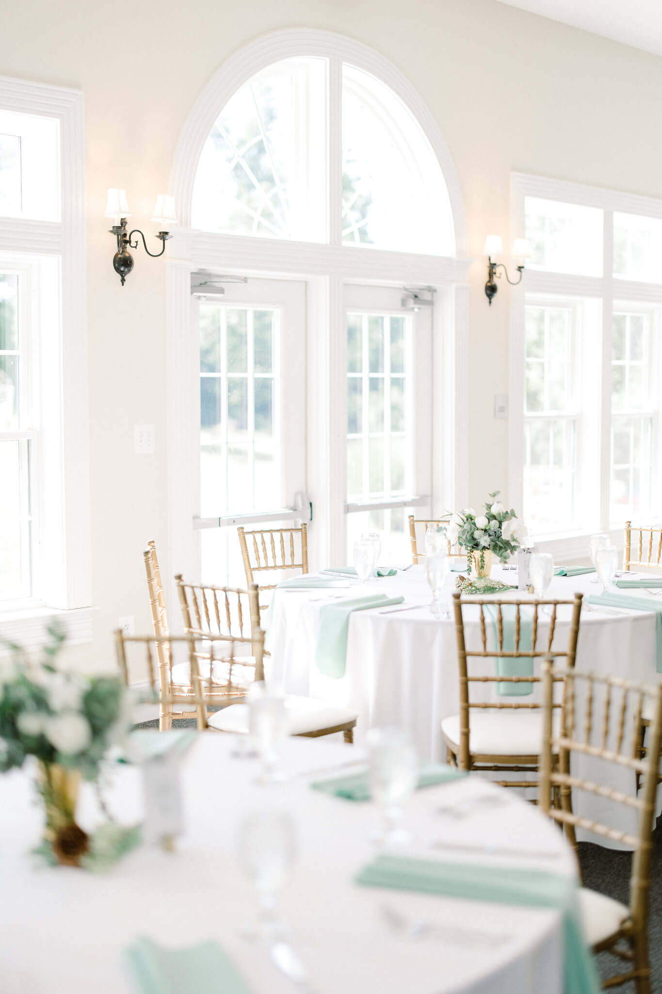 reception decor in white and sage at Stone Manor Country Club