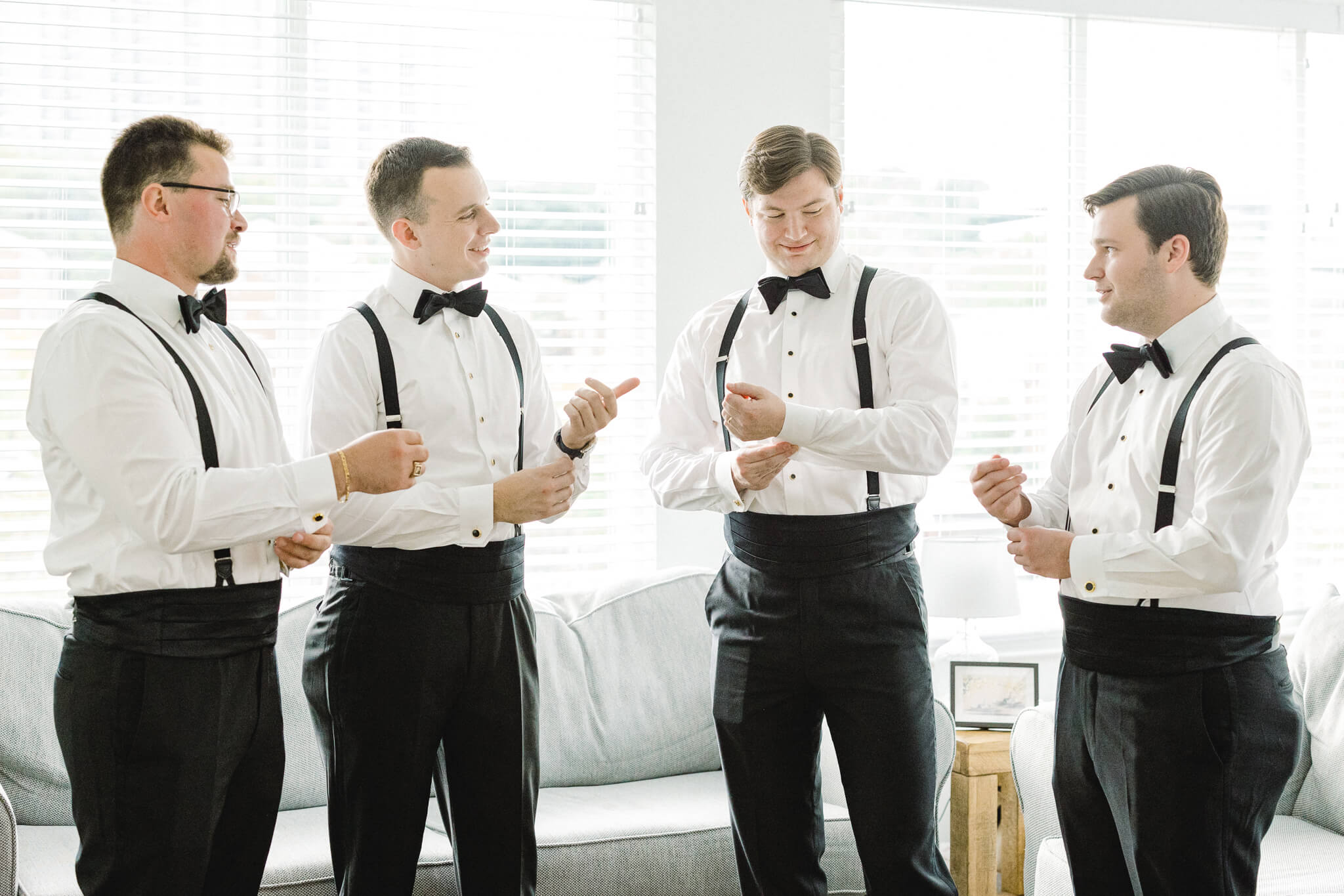 the groomsmen getting ready for the ceremony