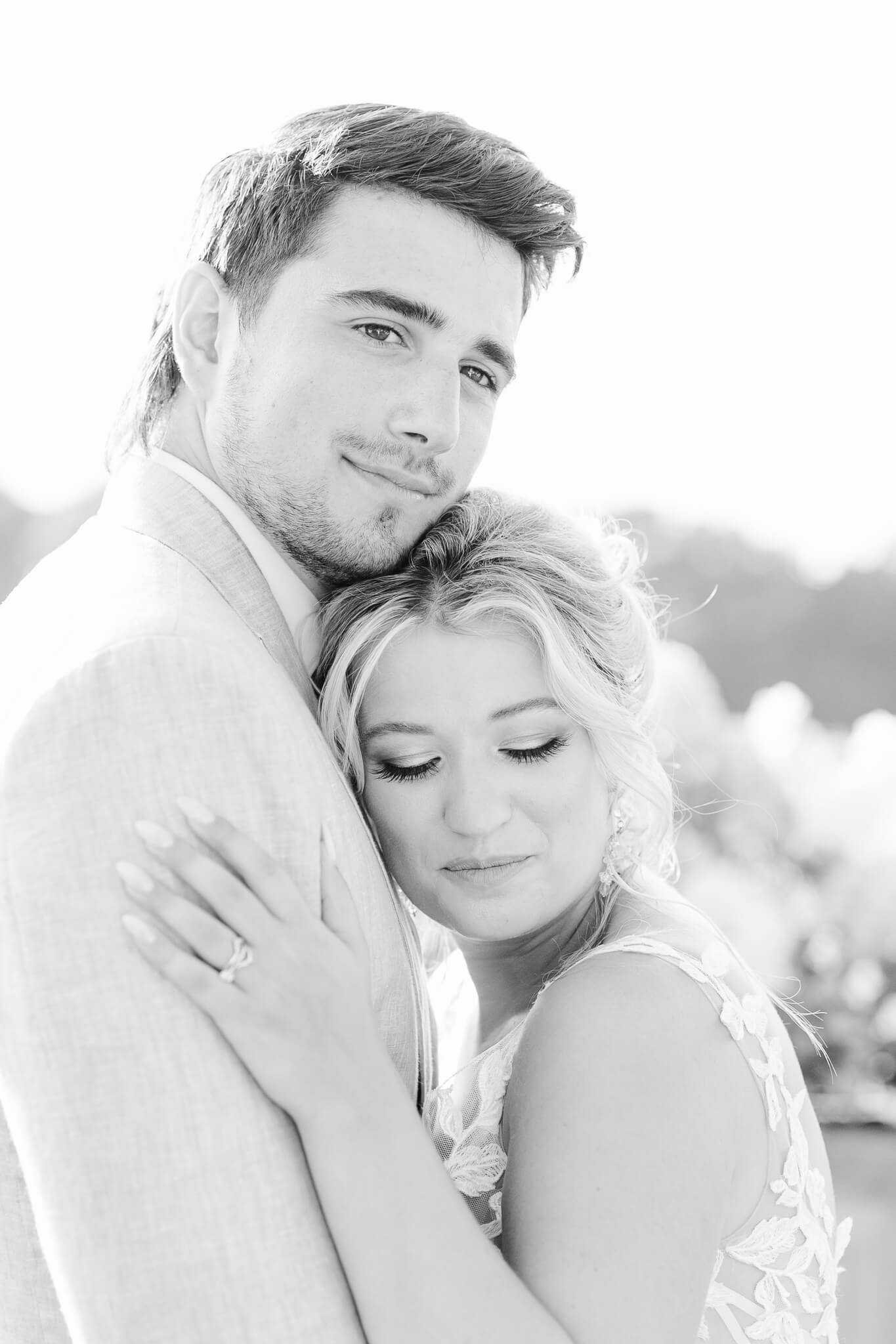 fine art photograph of bride and groom hugging