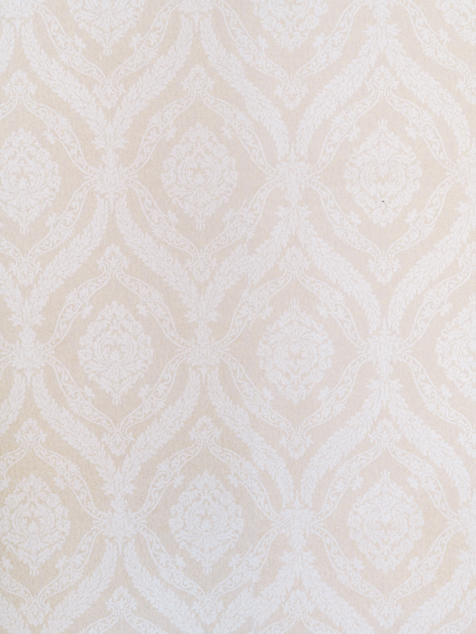 Closeup of the two-toned cream wallpaper in the Pippin Hill wedding bridal suite.