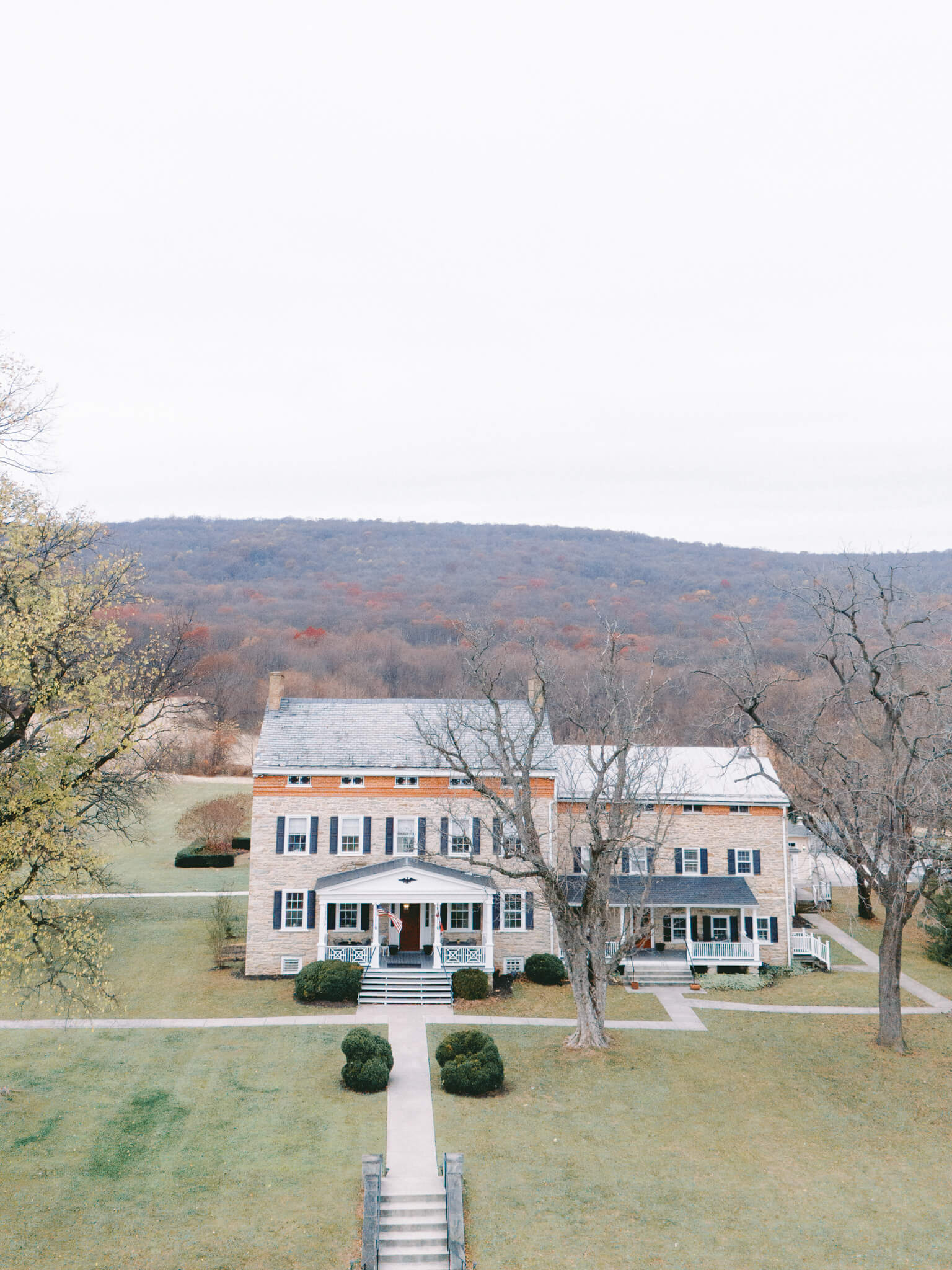 Aerial view of Springfield Manor wedding venue with mountains in the background.