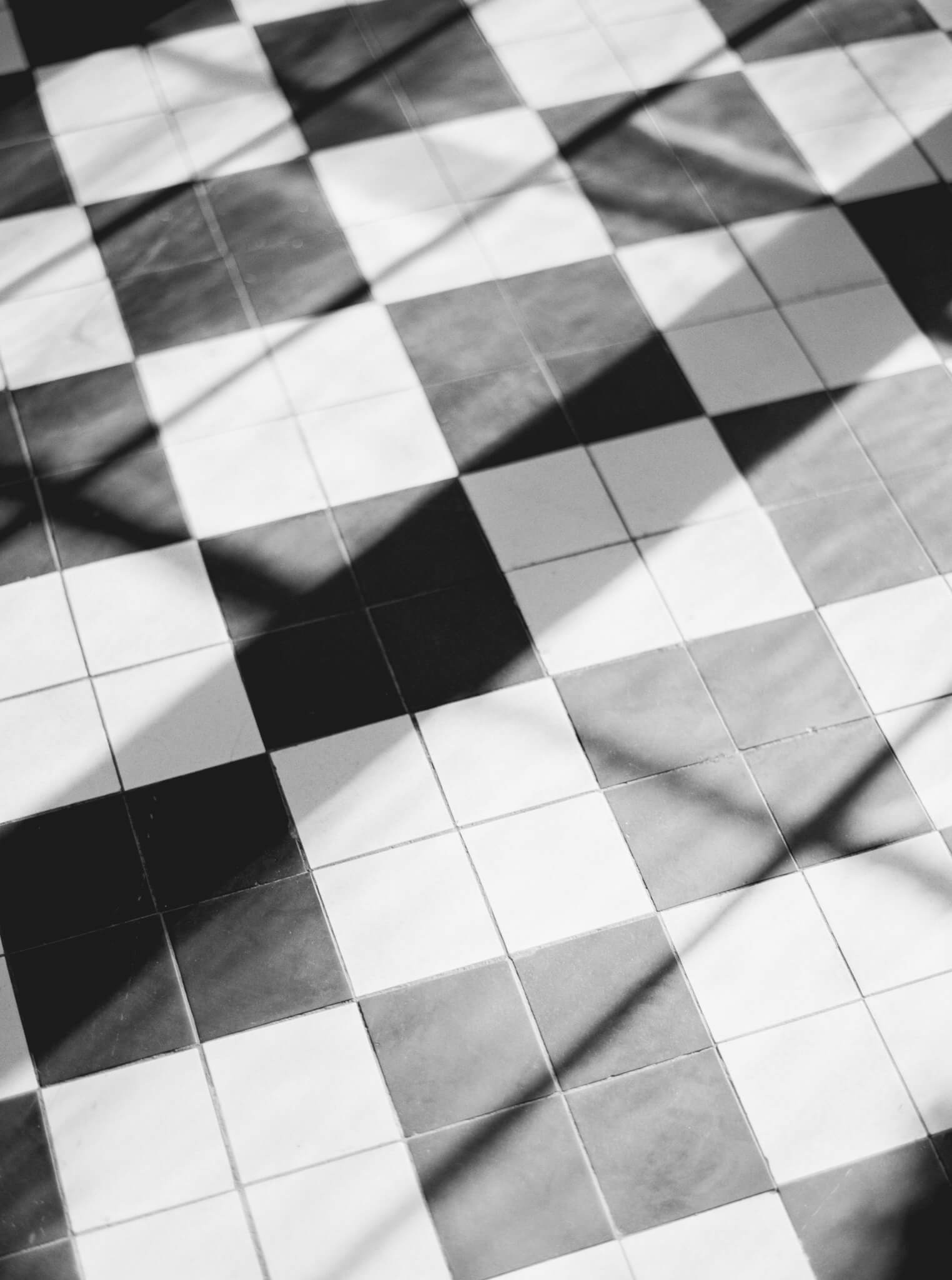 Black and white image of the checkered black and white floor at Lowndes Grove wedding venue.
