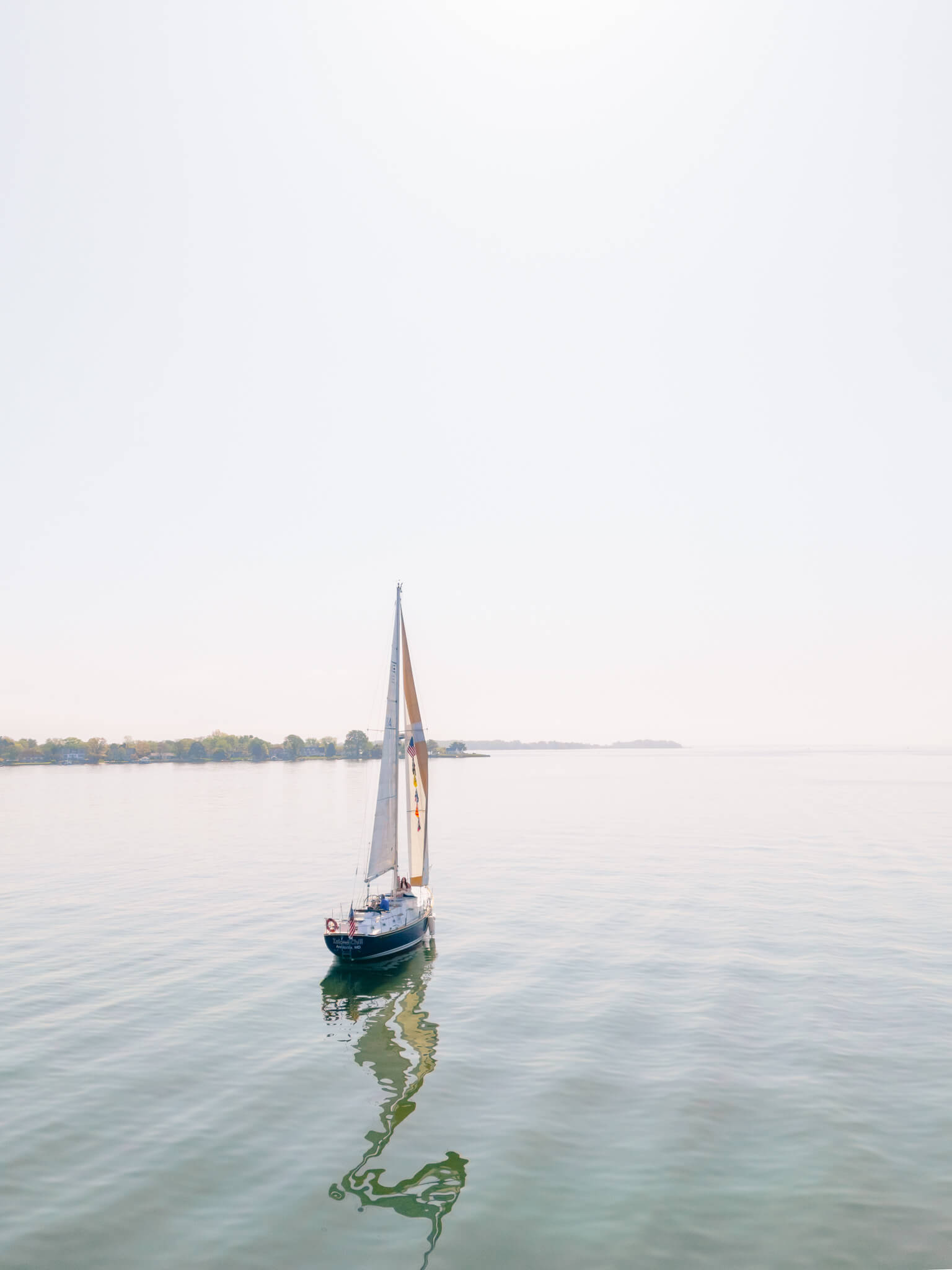 Drone image of a sailboat on the Chesapeake Bay.