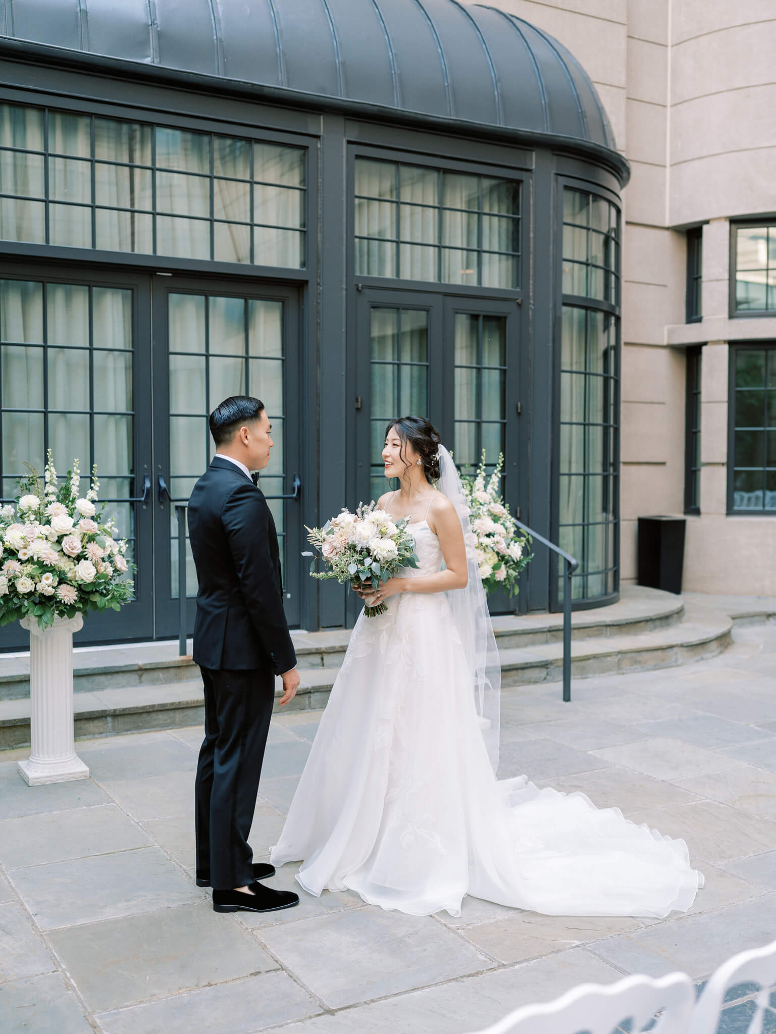 A bride and groom during their first look in the courtyard of the Westin Georgetown in Washington, D.C.