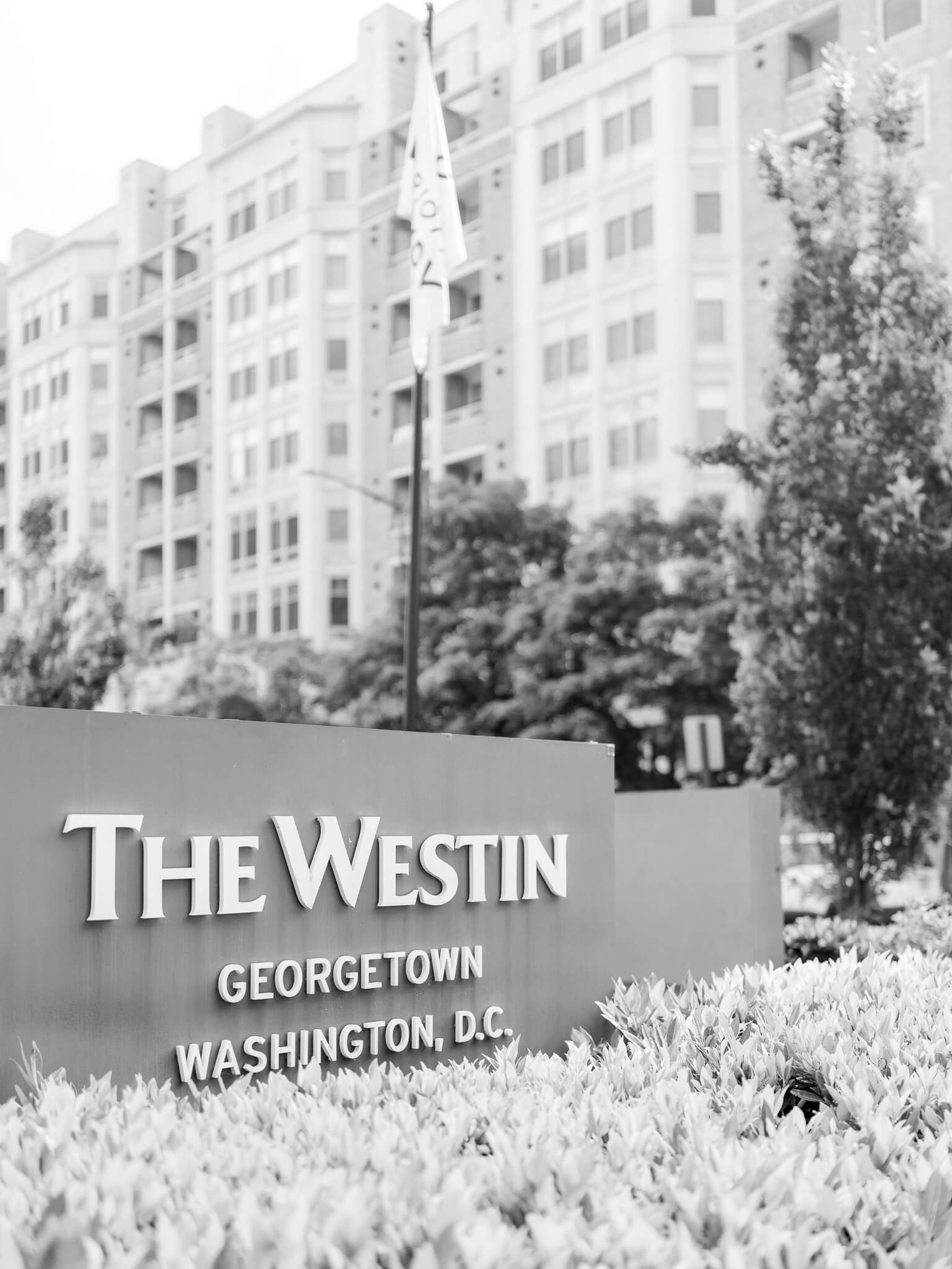 Black and white image of the sign at the front of the Westin Georgetown hotel in Washington, D.C.