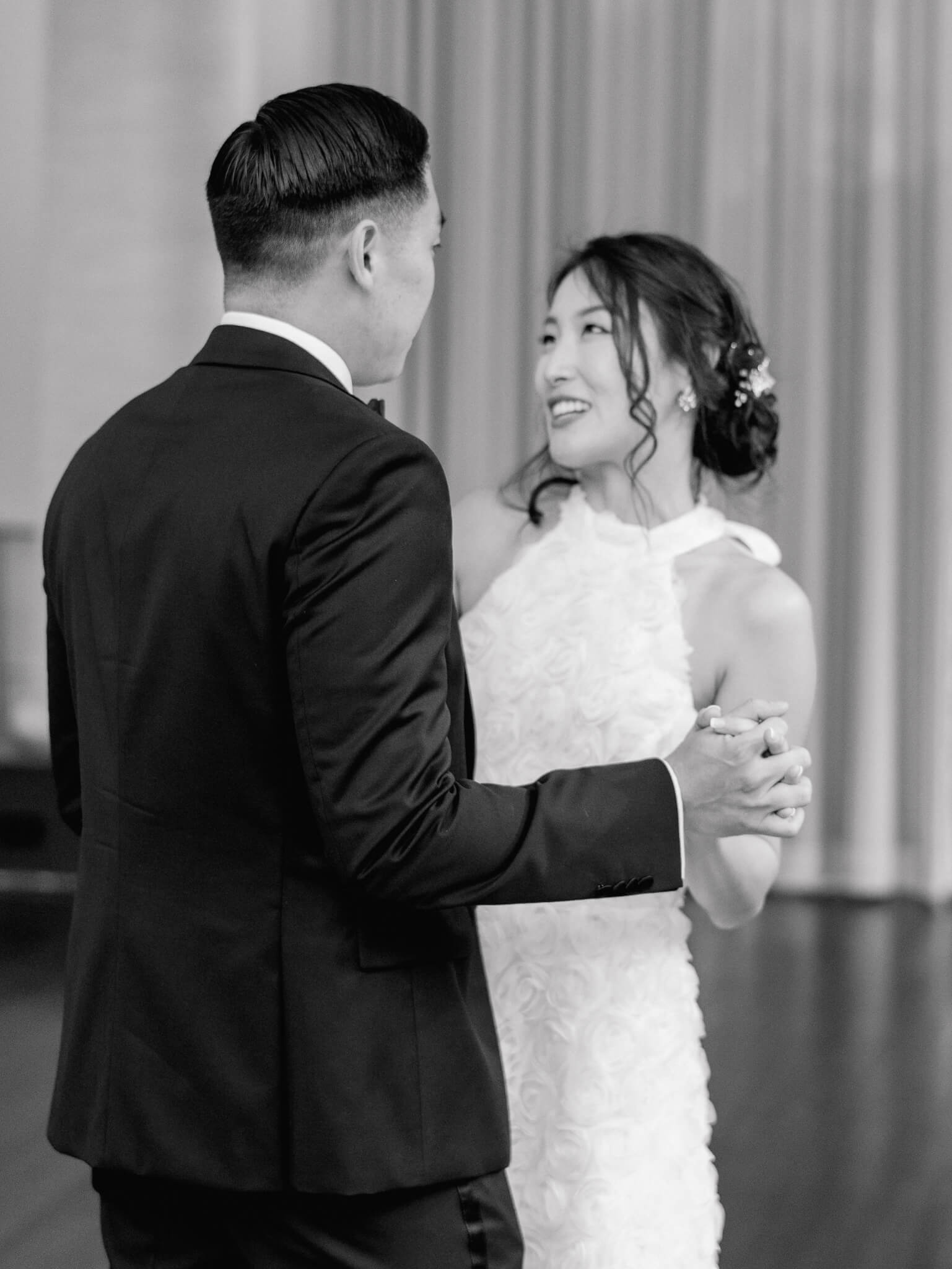 Black and white closeup of a bride looking at her groom during their first dance at the Westin in Georgetown, D.C.